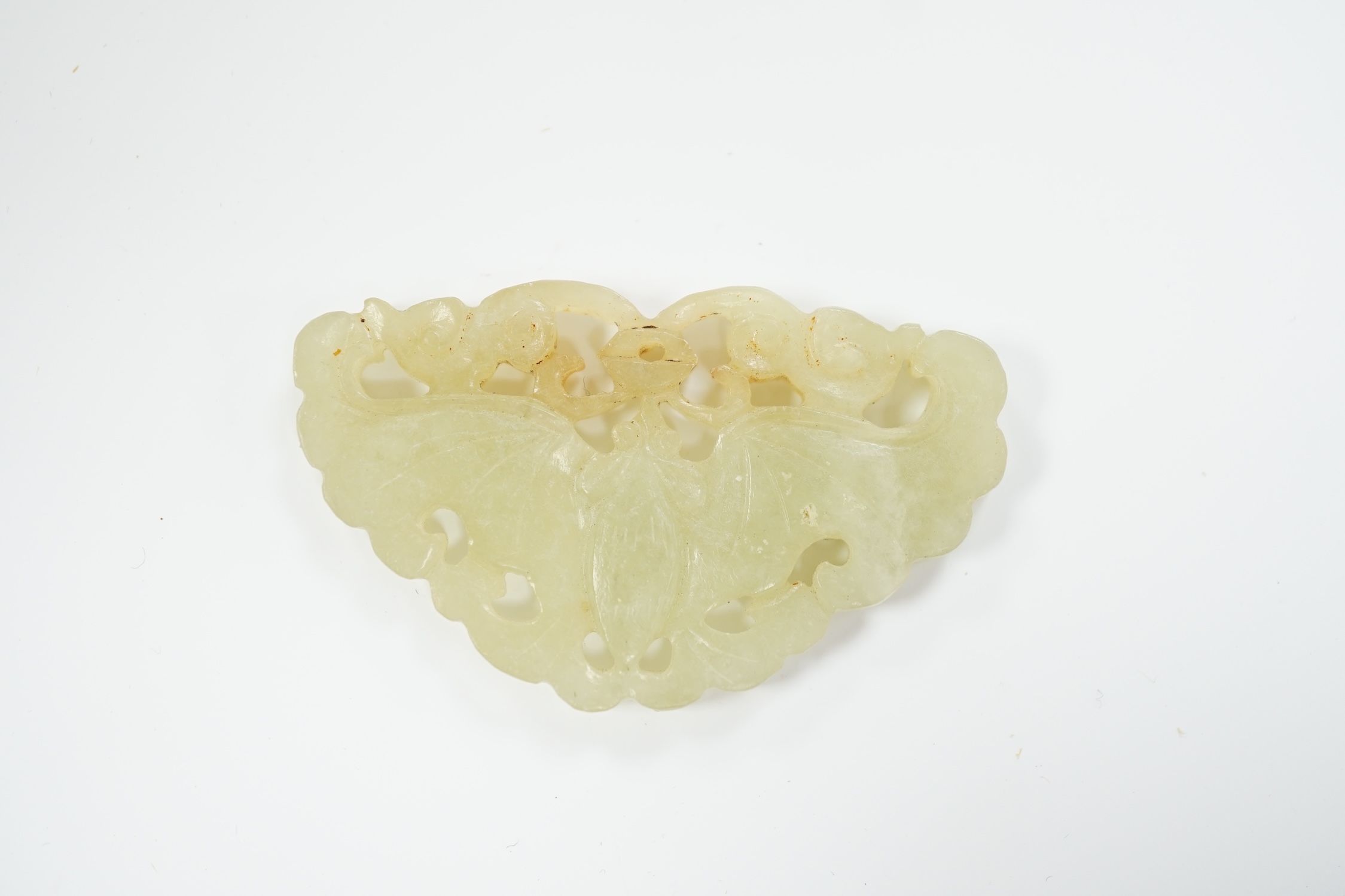 A Chinese carved jade plaque, 5.2cm wide